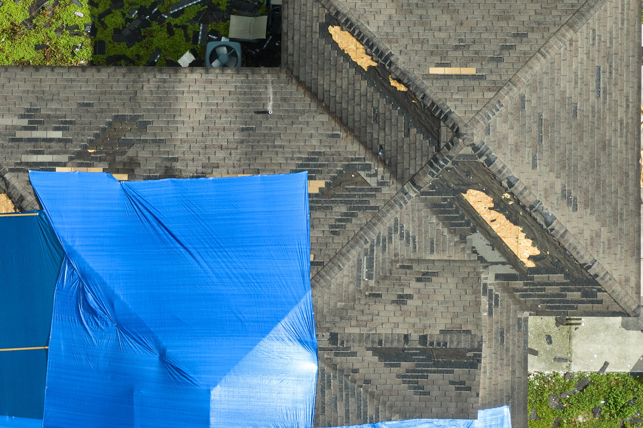 Extensive emergency tarp secured to a roof
