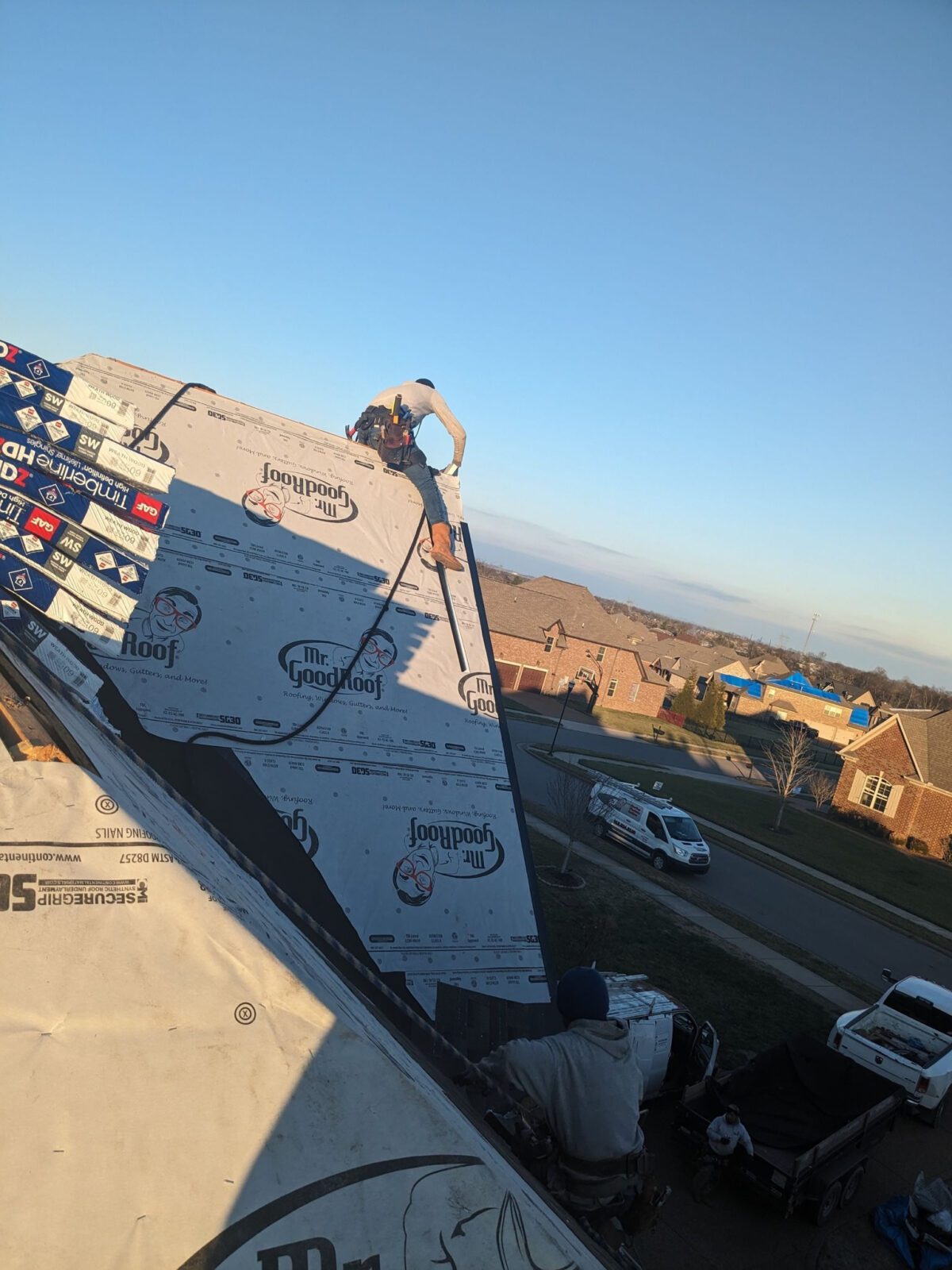 men working on a roof restoration