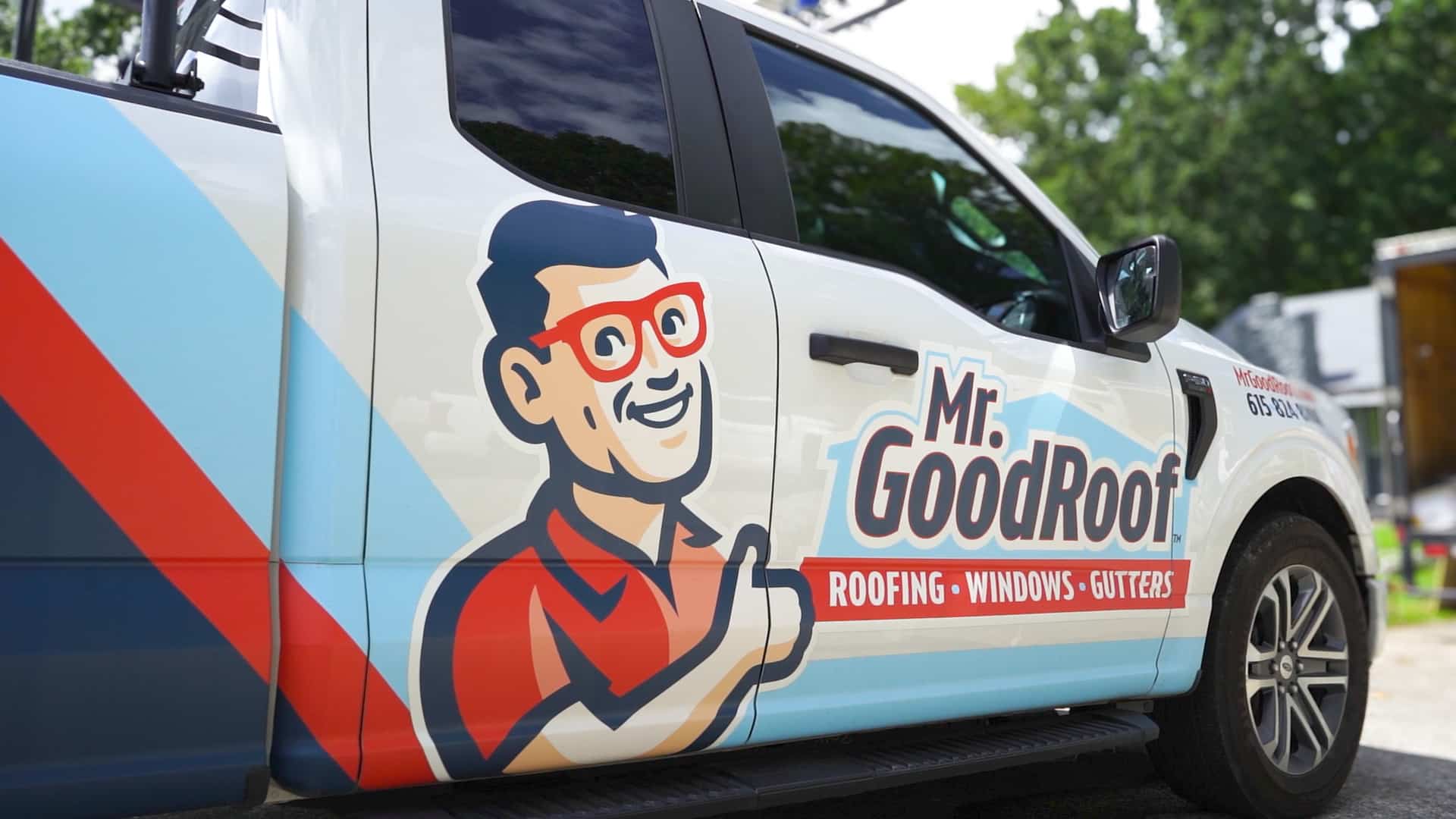A white truck with graphics for Mr Goodroof in Nashville TN