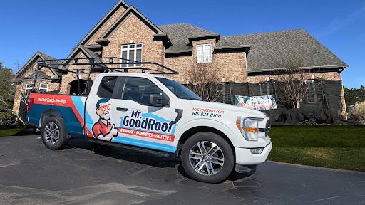 A white truck covered in graphics for Mr Goodroof