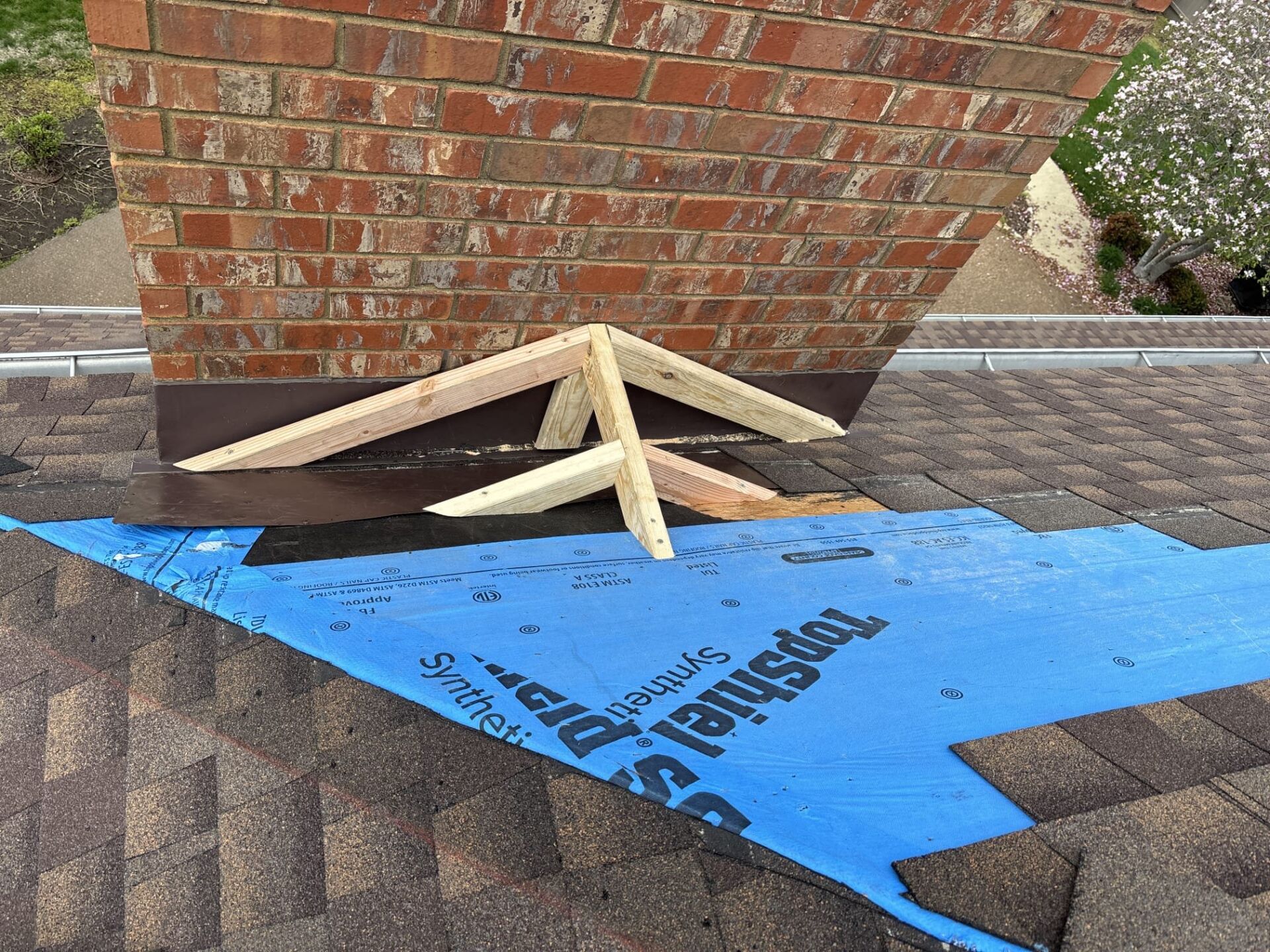 Roof cricket being repaired by mr goodroof