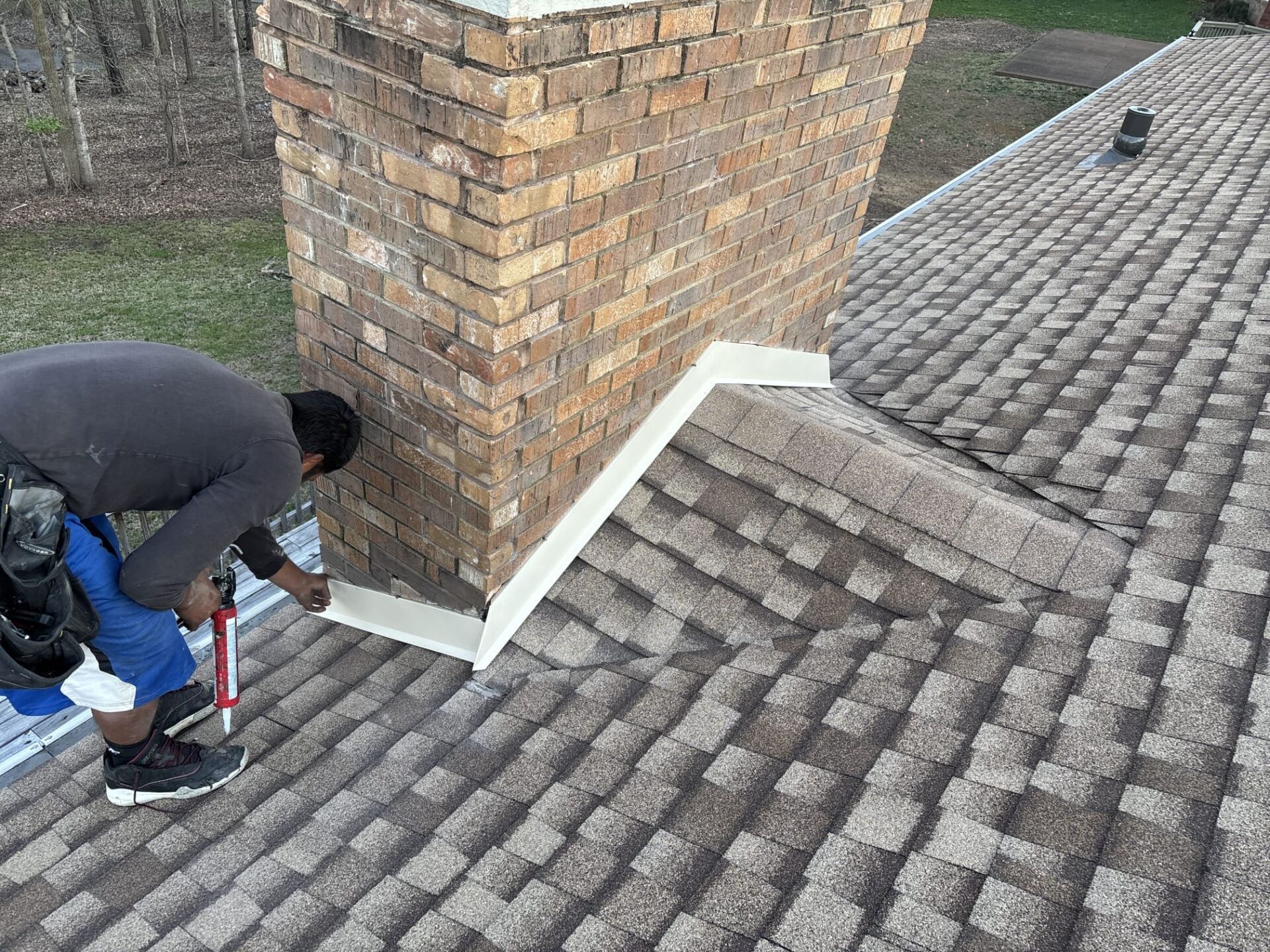 A man working on a roof for mr goodroof