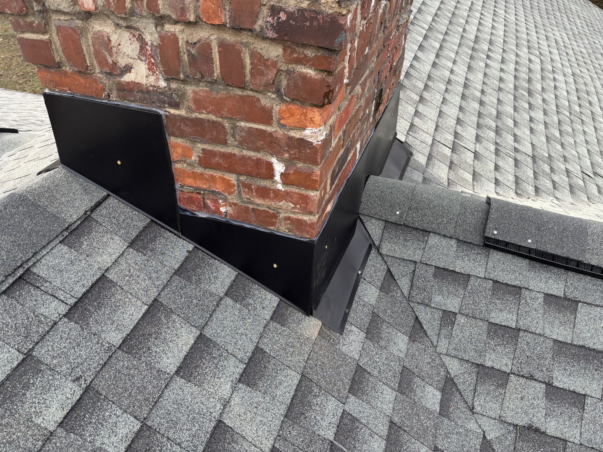 A man working on a roof for mr goodroof