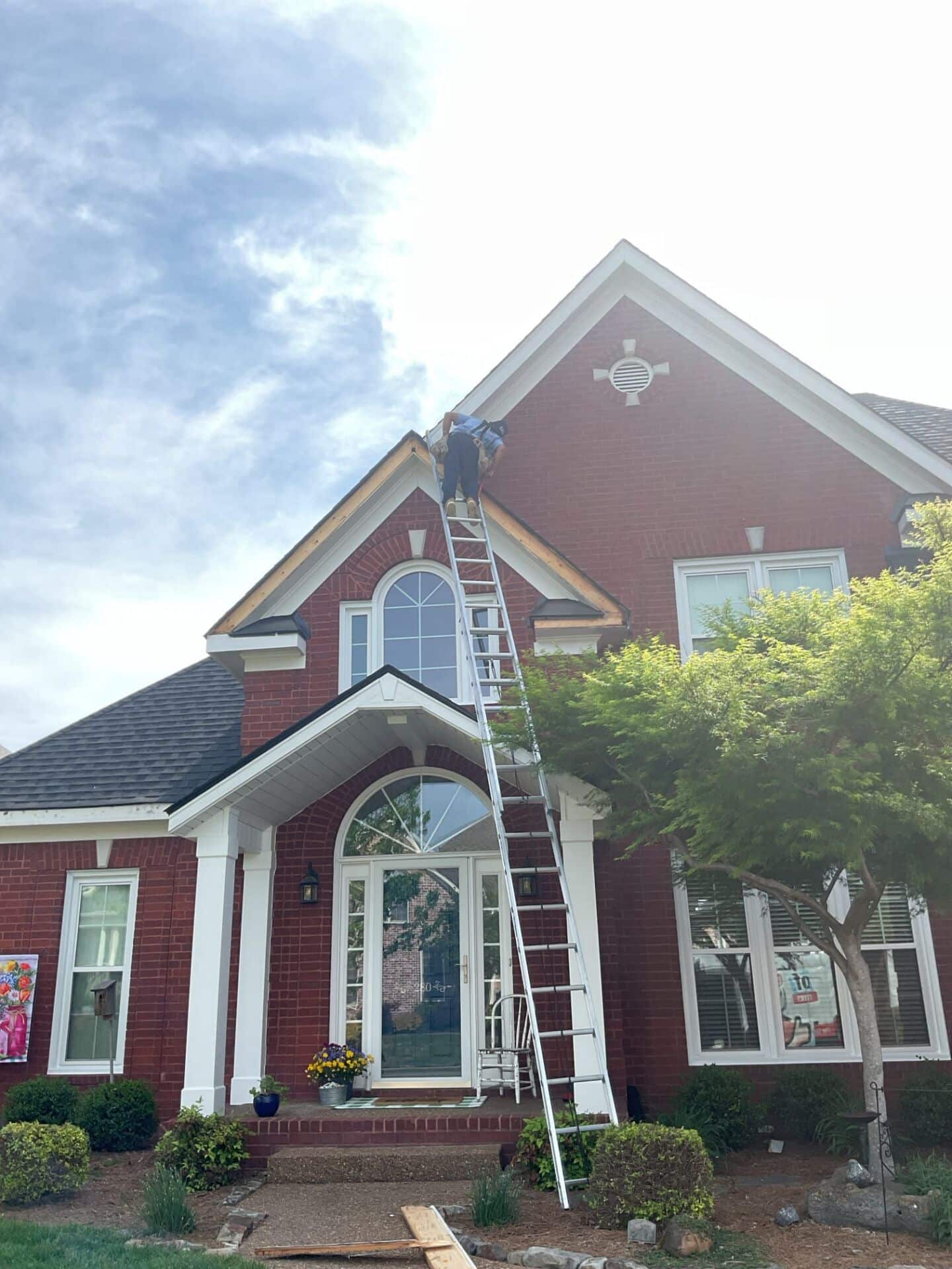 A mr goodroof technician repairing fascia on a roof in nashvill