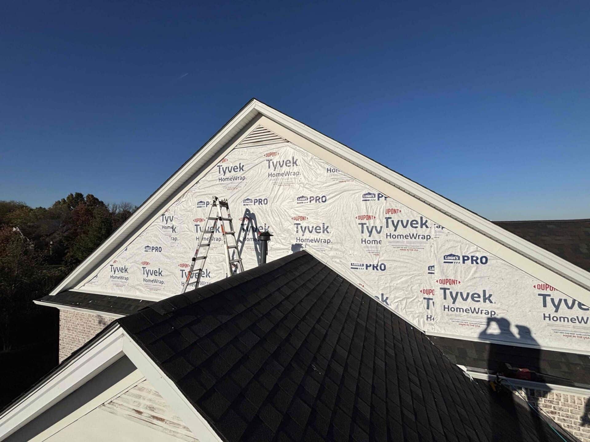 A man working on a roof for mr goodroof