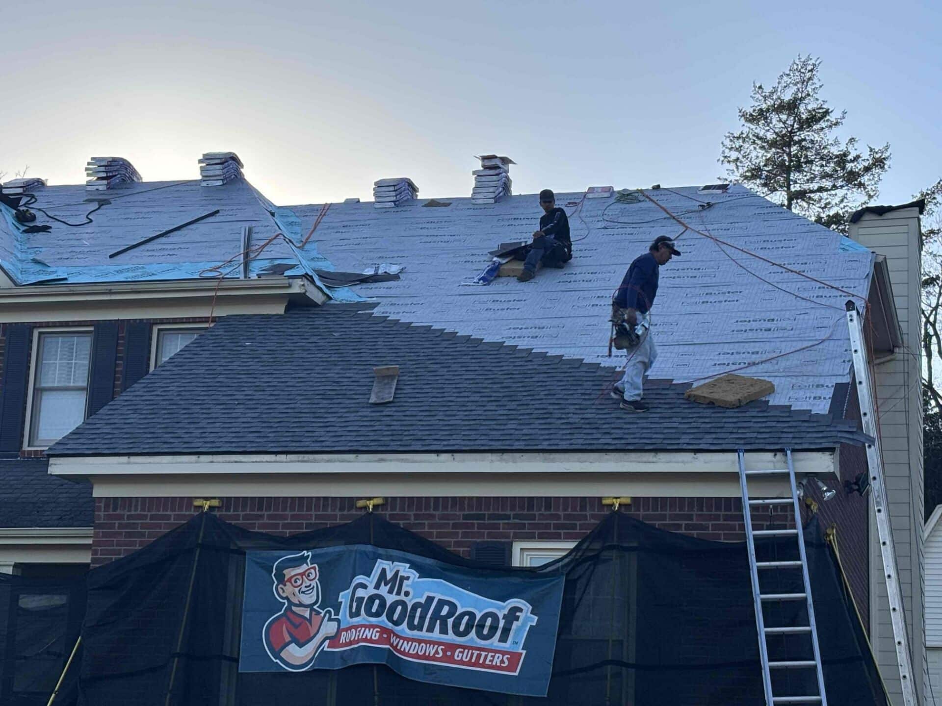 A man working on a roof for mr goodroof