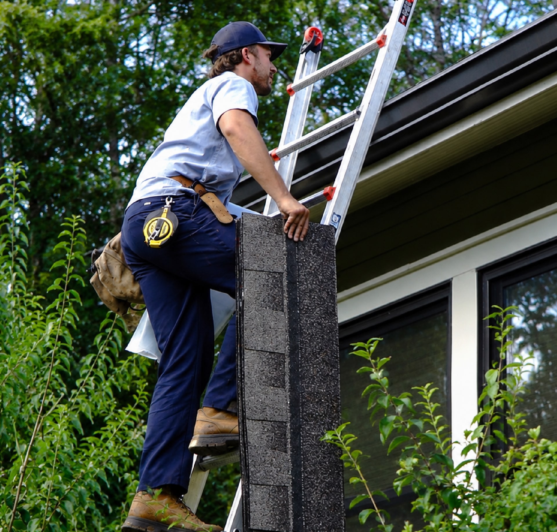 A mr goodroof technician working on a roof repair
