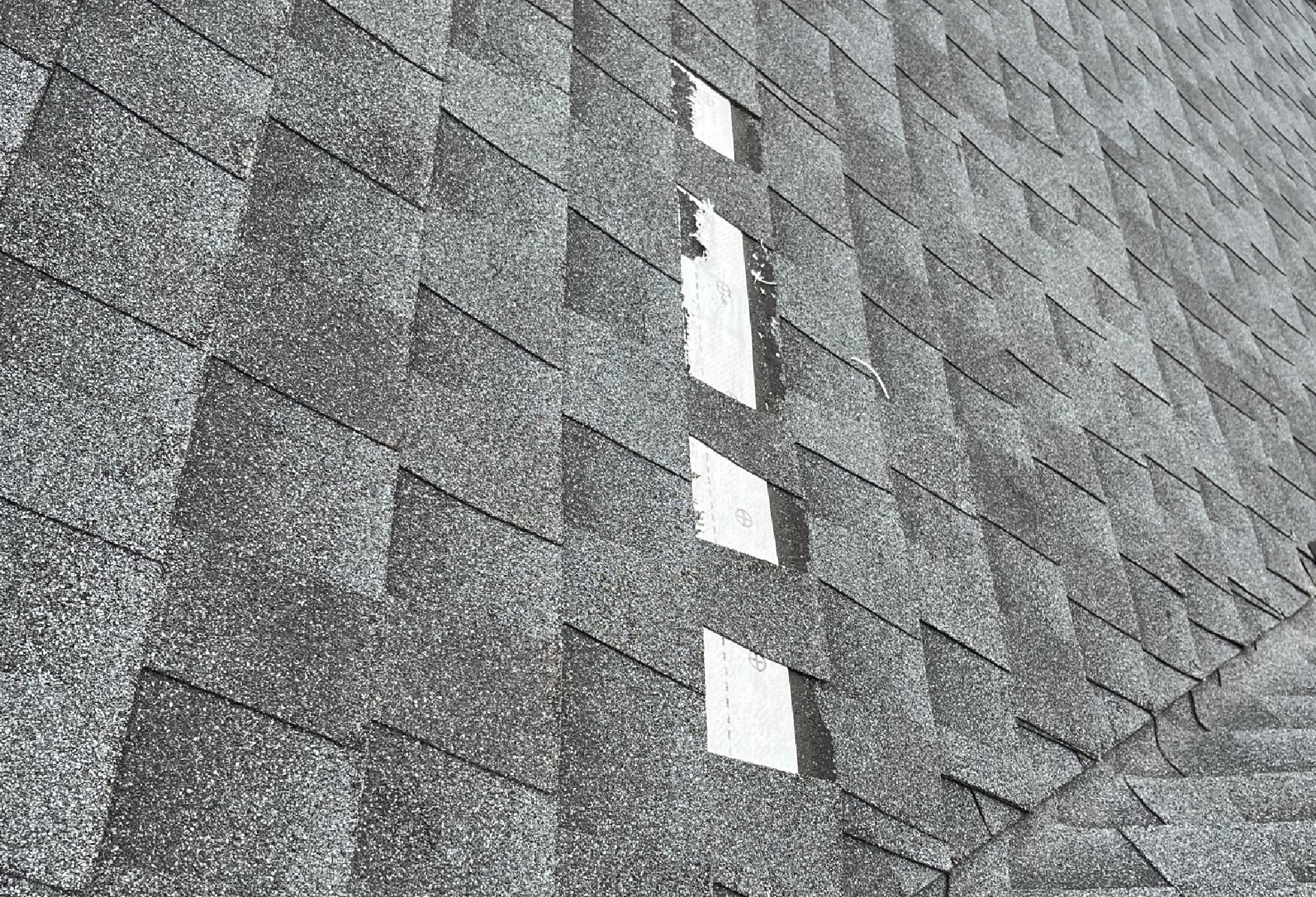 shingles on a roof that need to be replaced
