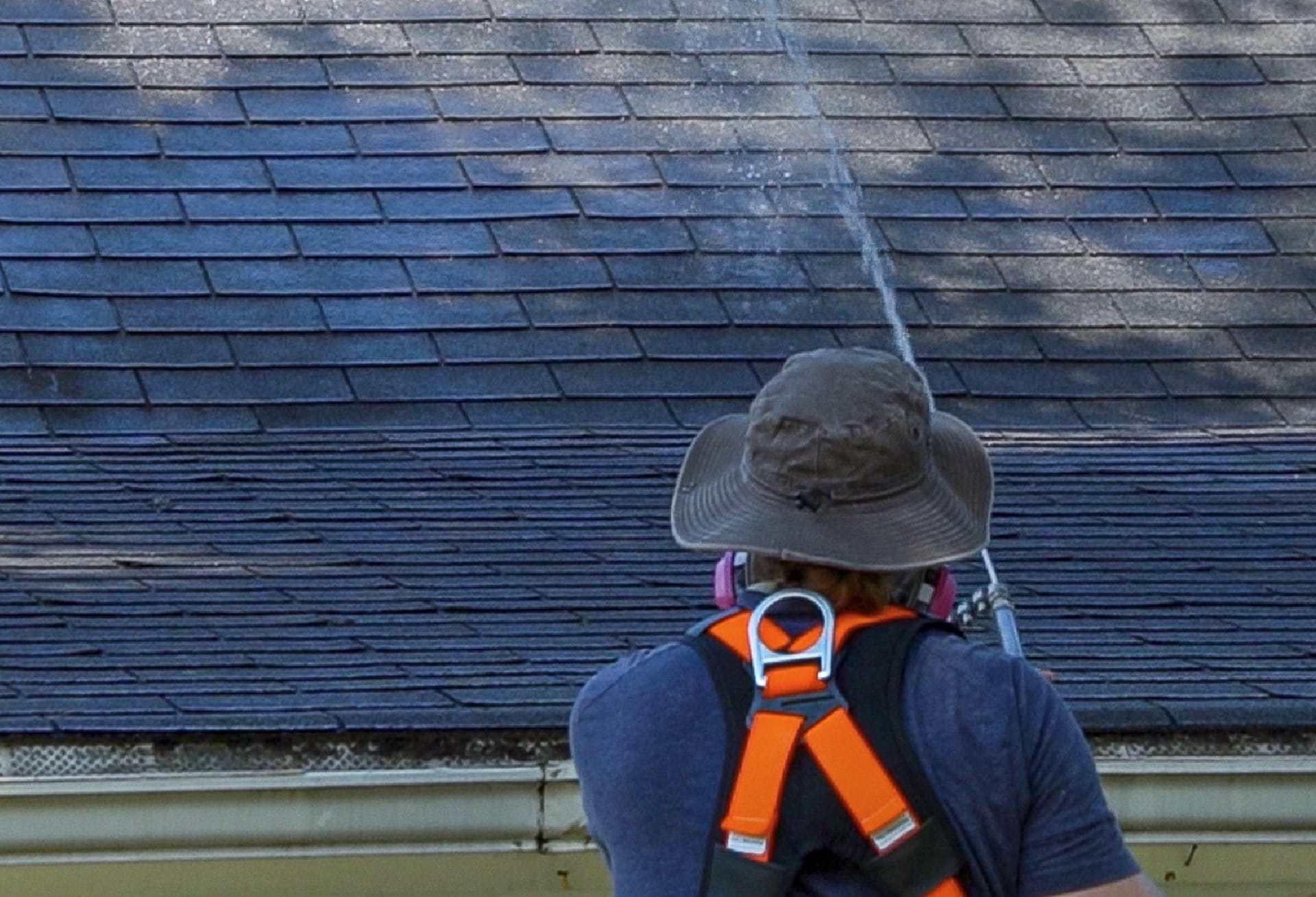 a mr goodroof technician restoring a roof