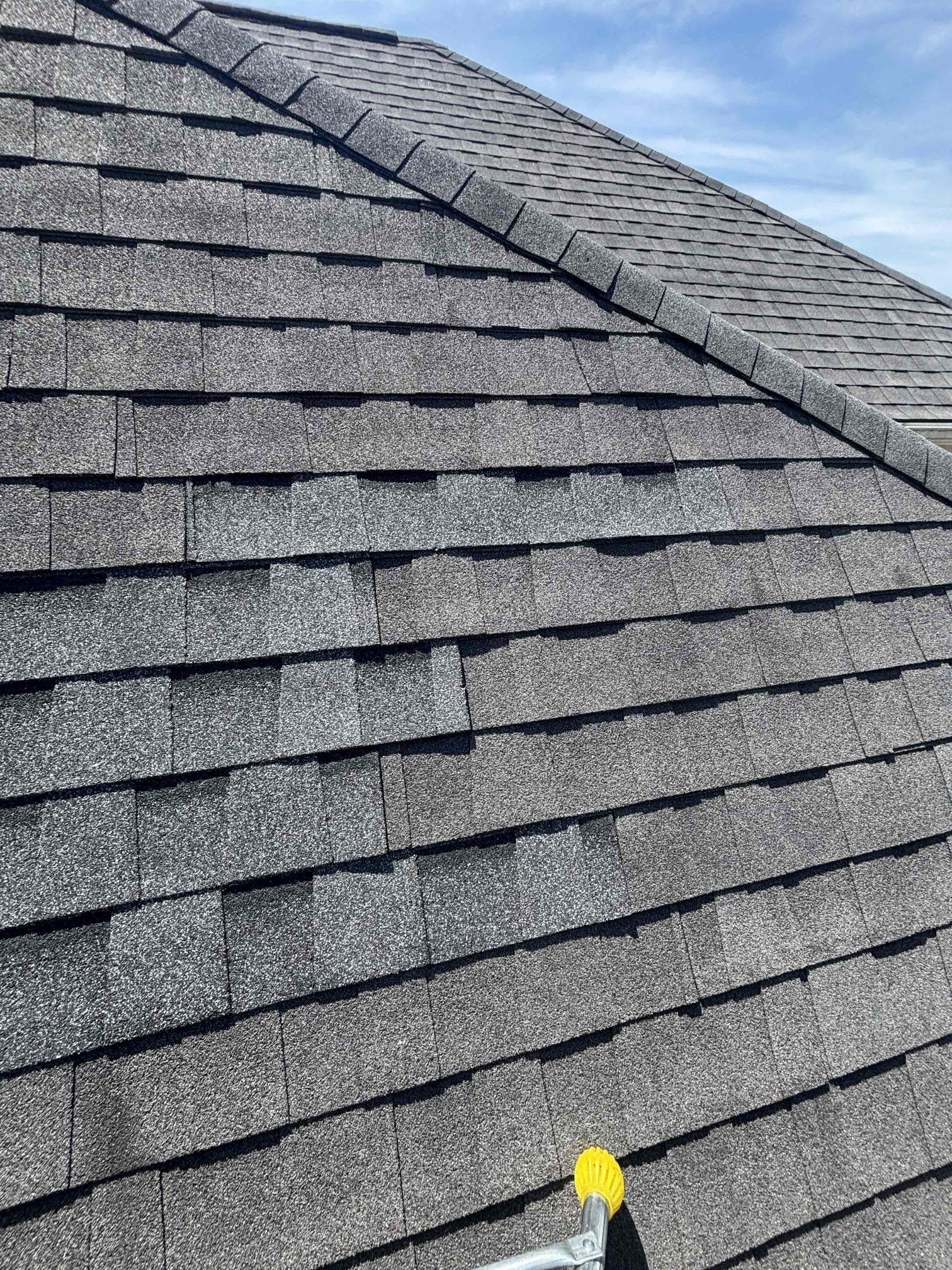 Lifted shingles documented during a Mr. GoodRoof roof repair inspection