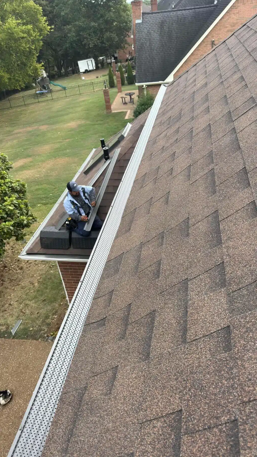 Antique Brown architectural shingles and a long run of gutter screen on the Hendersonville home.